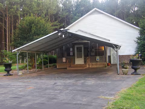 Garage and carport with paved drive