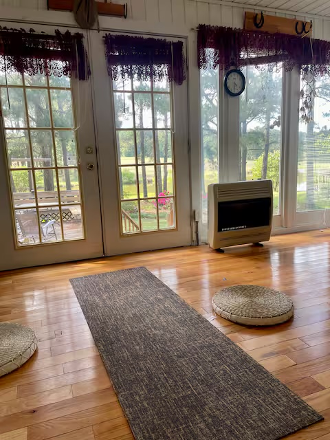Cozy sunroom with floor-to-ceiling windows